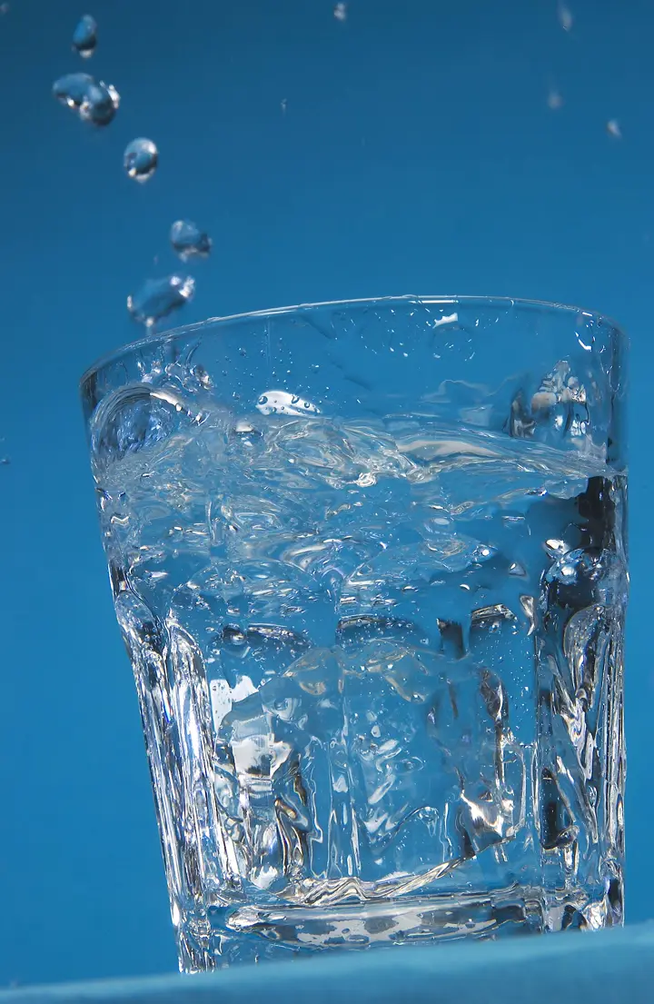 Water splashing from a full glass